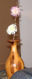 A couple of flowers added to tbe bud vase